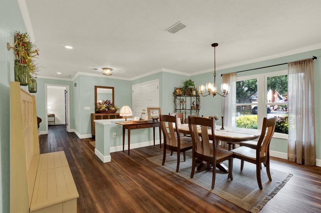 2806 Fairway View Drive Valrico, FL 33596 - Photo 16 of 45 a view of a dining room and livingroom with furniture wooden floor a chandelier