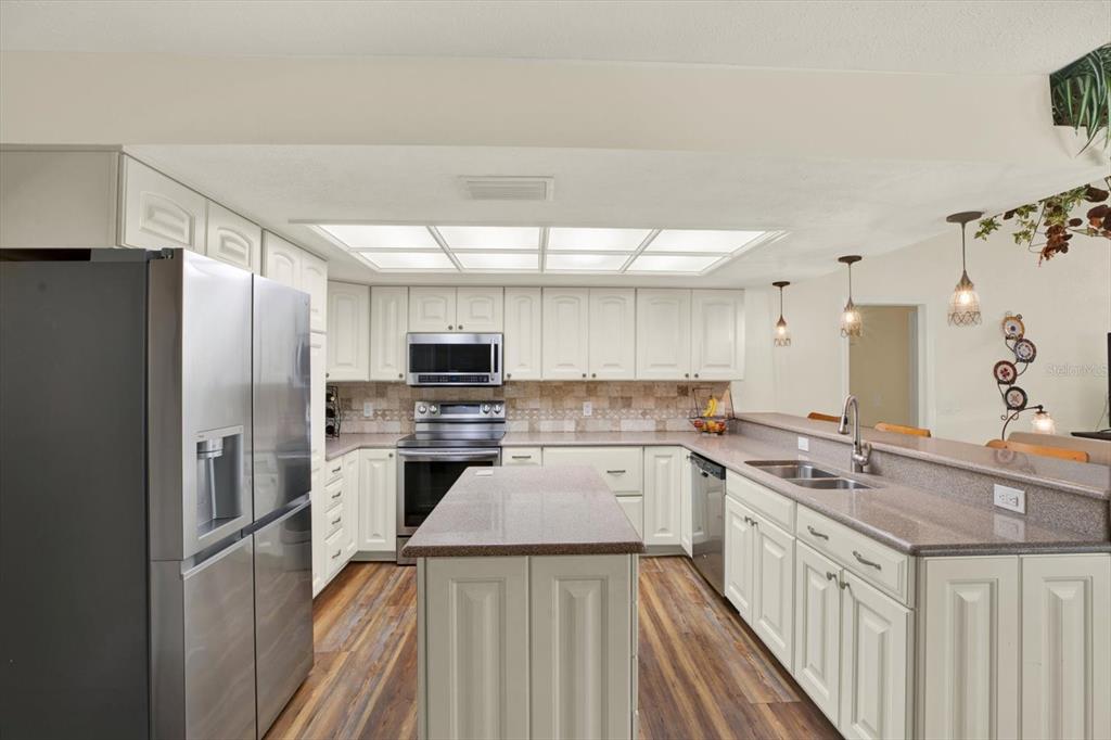 2806 Fairway View Drive Valrico, FL 33596 - Photo 20 of 45 a kitchen with a sink stove and refrigerator