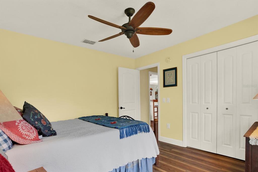 2806 Fairway View Drive Valrico, FL 33596 - Photo 29 of 45 a bedroom with a bed and a chandelier