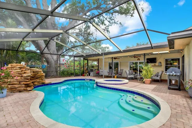 a view of a swimming pool with a patio