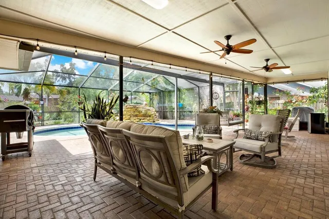 a view of a patio with a dining table and chairs