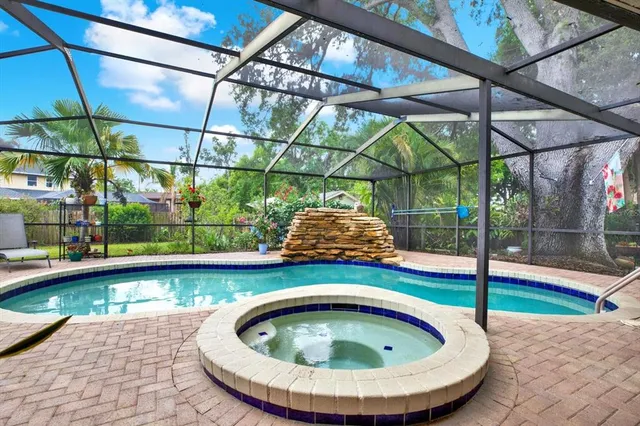 a view of a swimming pool with a patio