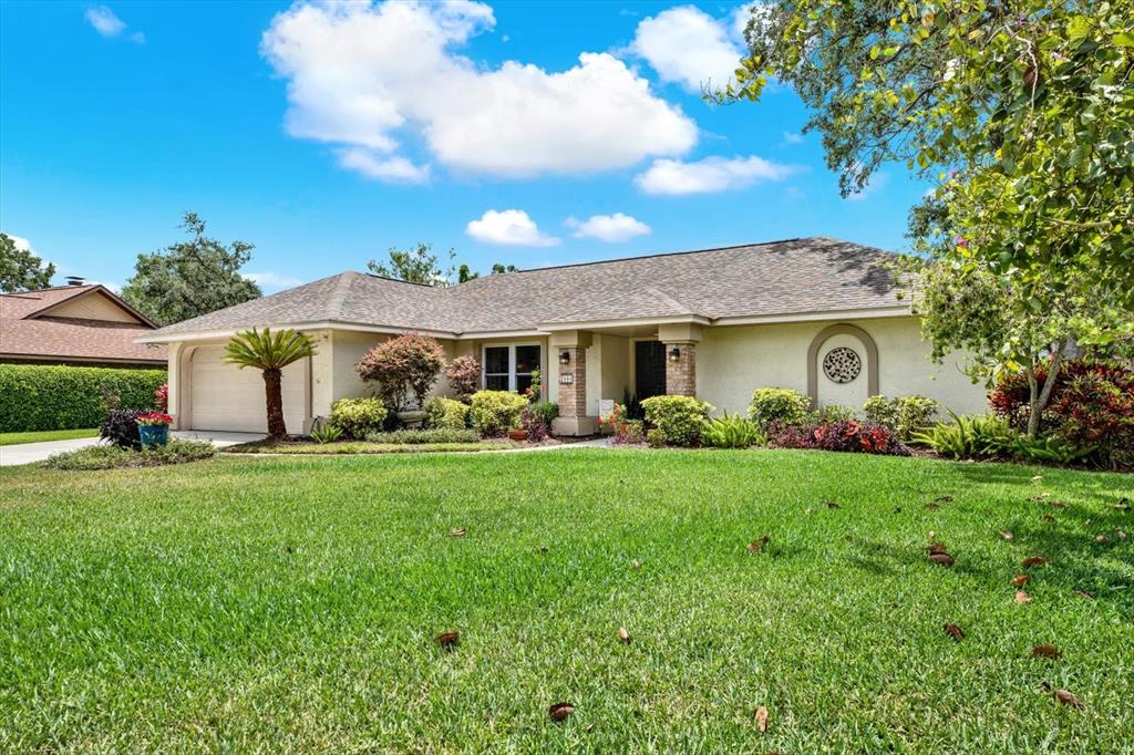 2806 Fairway View Drive Valrico, FL 33596 - Photo 44 of 45 a front view of a house with a garden