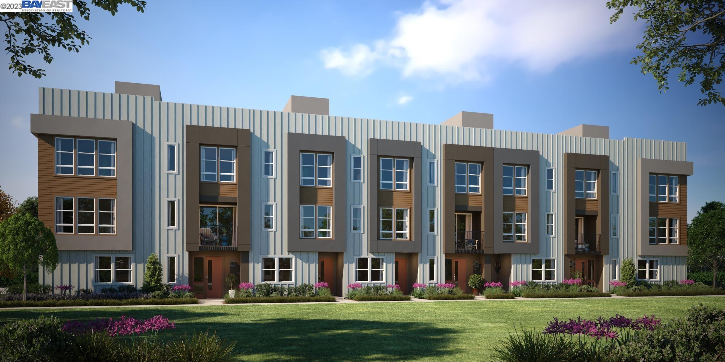 front view of a brick building next to a yard