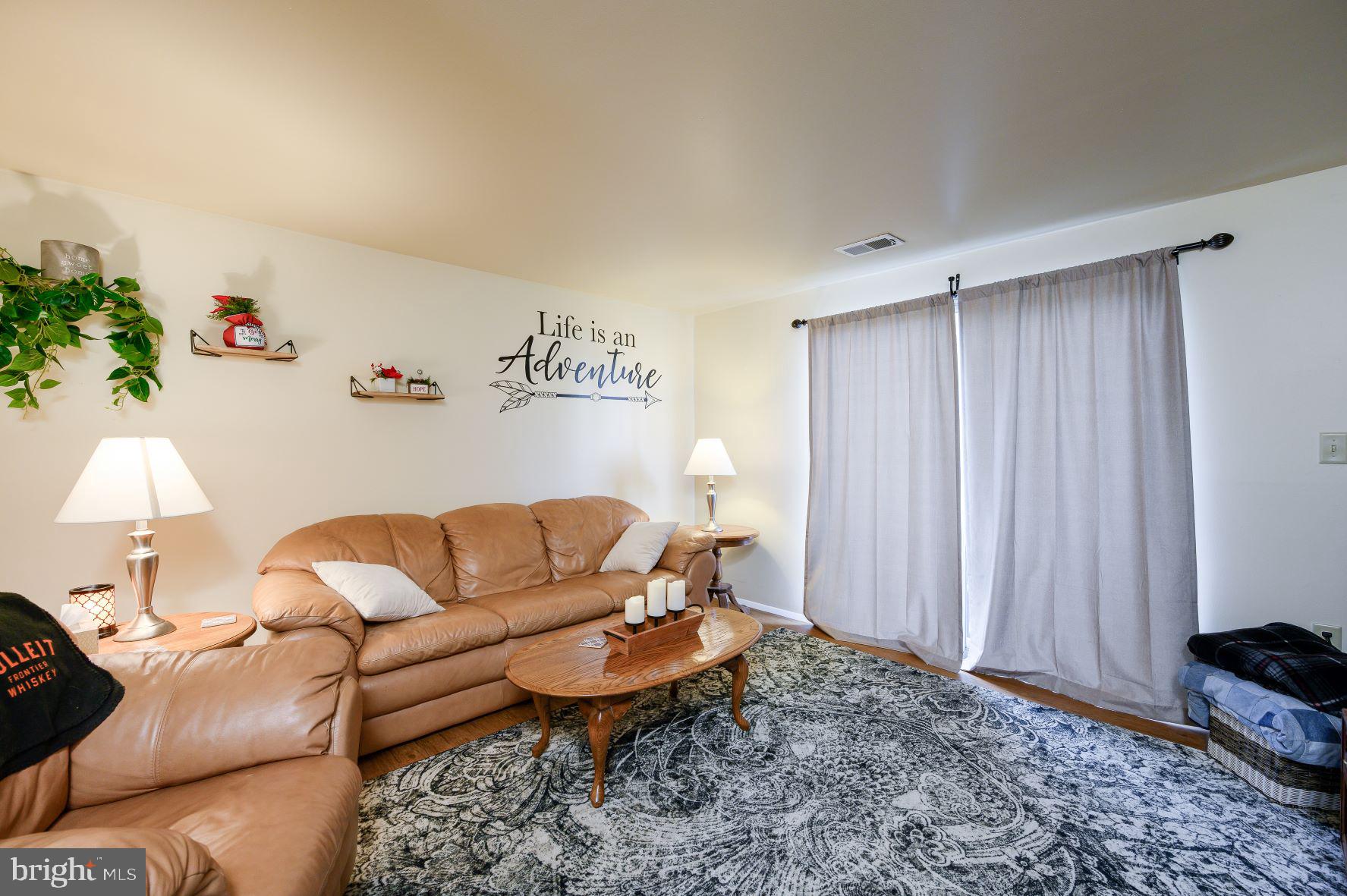 137 Roberta Jean Avenue Littlestown, PA 17340 - Photo 3 of 8 a living room with furniture and a window