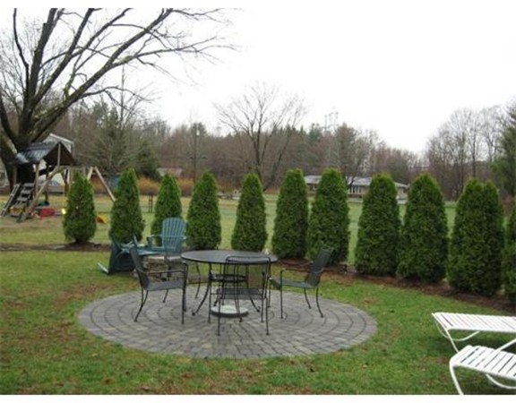 36 East Leverett Road Amherst, MA 01002 - Photo 17 of 18 a table and chairs in the garden