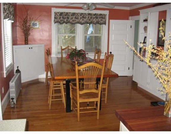 36 East Leverett Road Amherst, MA 01002 - Photo 4 of 18 a view of a dining room with furniture and wooden floor