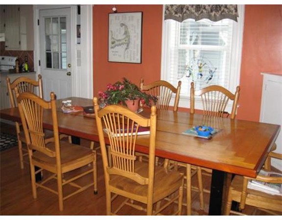 36 East Leverett Road Amherst, MA 01002 - Photo 5 of 18 a view of a dining room with furniture and chandelier