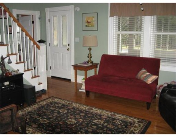 36 East Leverett Road Amherst, MA 01002 - Photo 7 of 18 a living room with furniture a rug and a window