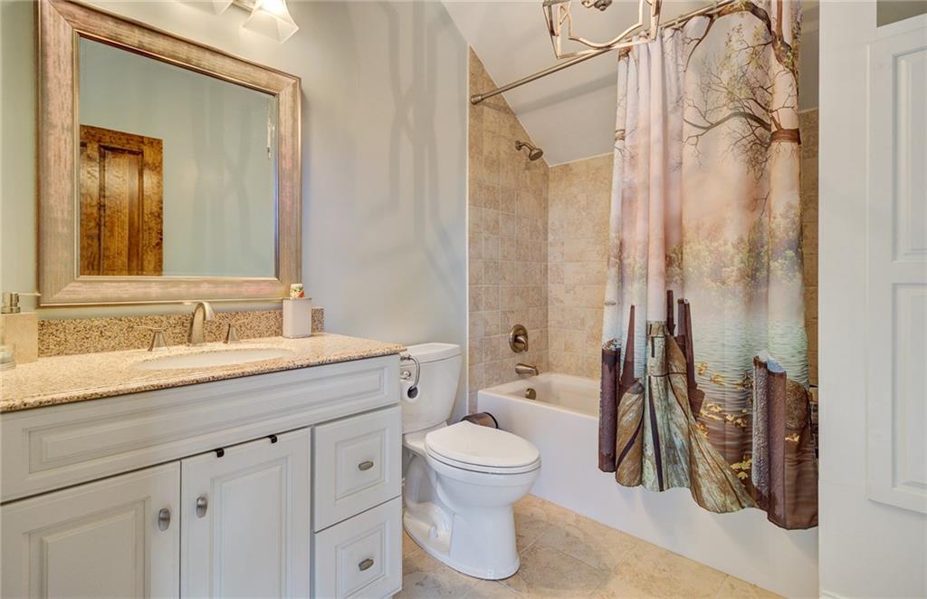 122 Klein Road Cranberry Township, PA 16066 - Photo 17 of 25 Upper level ensuite with granite vanity, Duravit extra deep soaking tub/shower, decorative chandelier, tile flooring and laundry shoot in linen closet.
