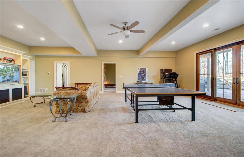 122 Klein Road Cranberry Township, PA 16066 - Photo 19 of 25 30x24 LL family room with wall to wall carpet, built-ins, Pella sliders to the outside 53x27 rolled finish stained concrete patio with decorative stone landscaping, built in speakers, recessed lighting and lots of storage. Home features a tankless water heater with circulation pump, air exchange, two a/c units (1st and 2nd floor) and three heat units (one per floor).