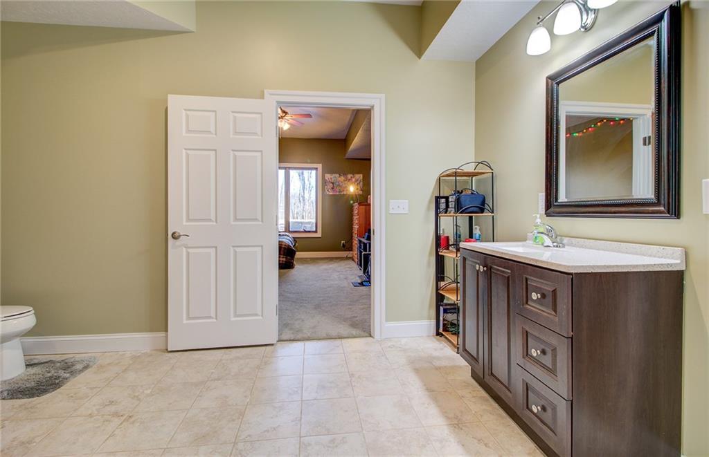 122 Klein Road Cranberry Township, PA 16066 - Photo 21 of 25 3rd bedroom ensuite with tile flooring, granite vanity, walk-in closet and shower.