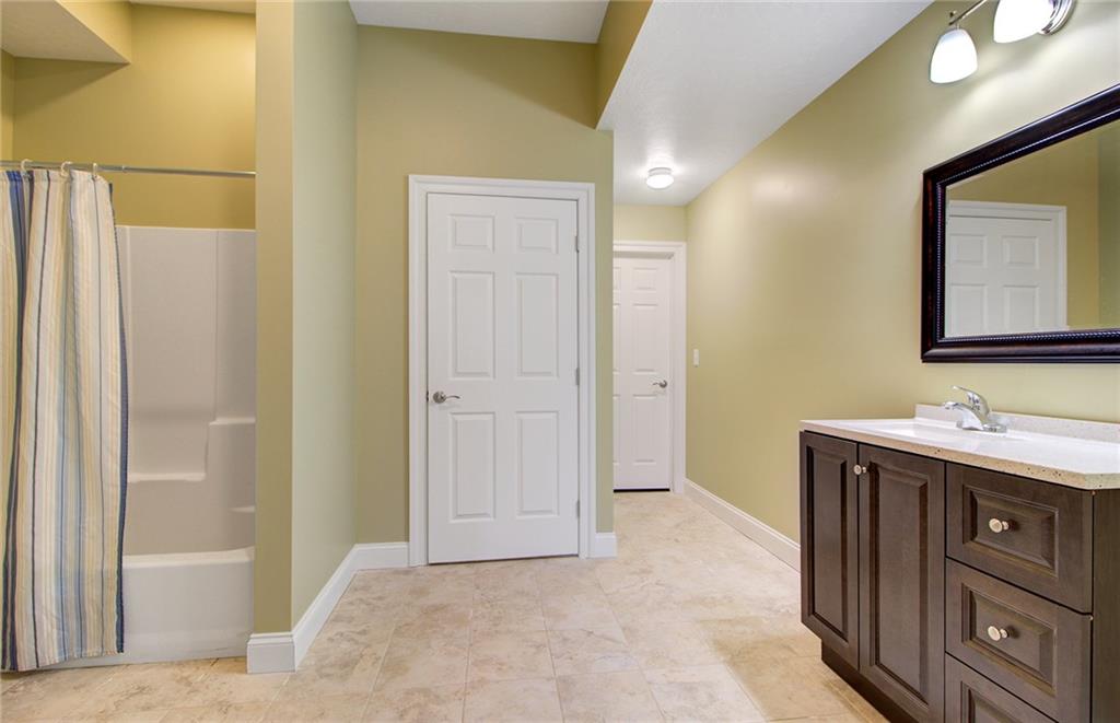 122 Klein Road Cranberry Township, PA 16066 - Photo 23 of 25 4th bedroom ensuite with granite vanity, tile flooring, large closet, shower and access to storage hall.