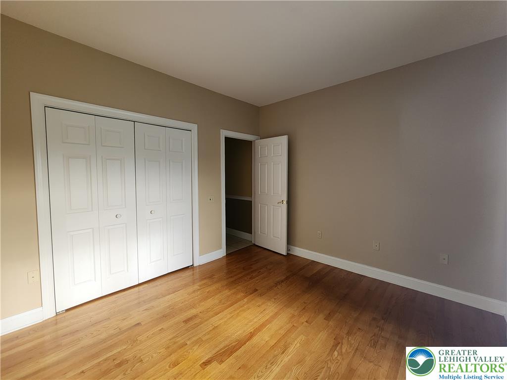 578 Daniels Road Nazareth, PA 18064 - Photo 36 of 45 Rich hardwood flooring anchors this versatile space featuring classic paneled closet doors.