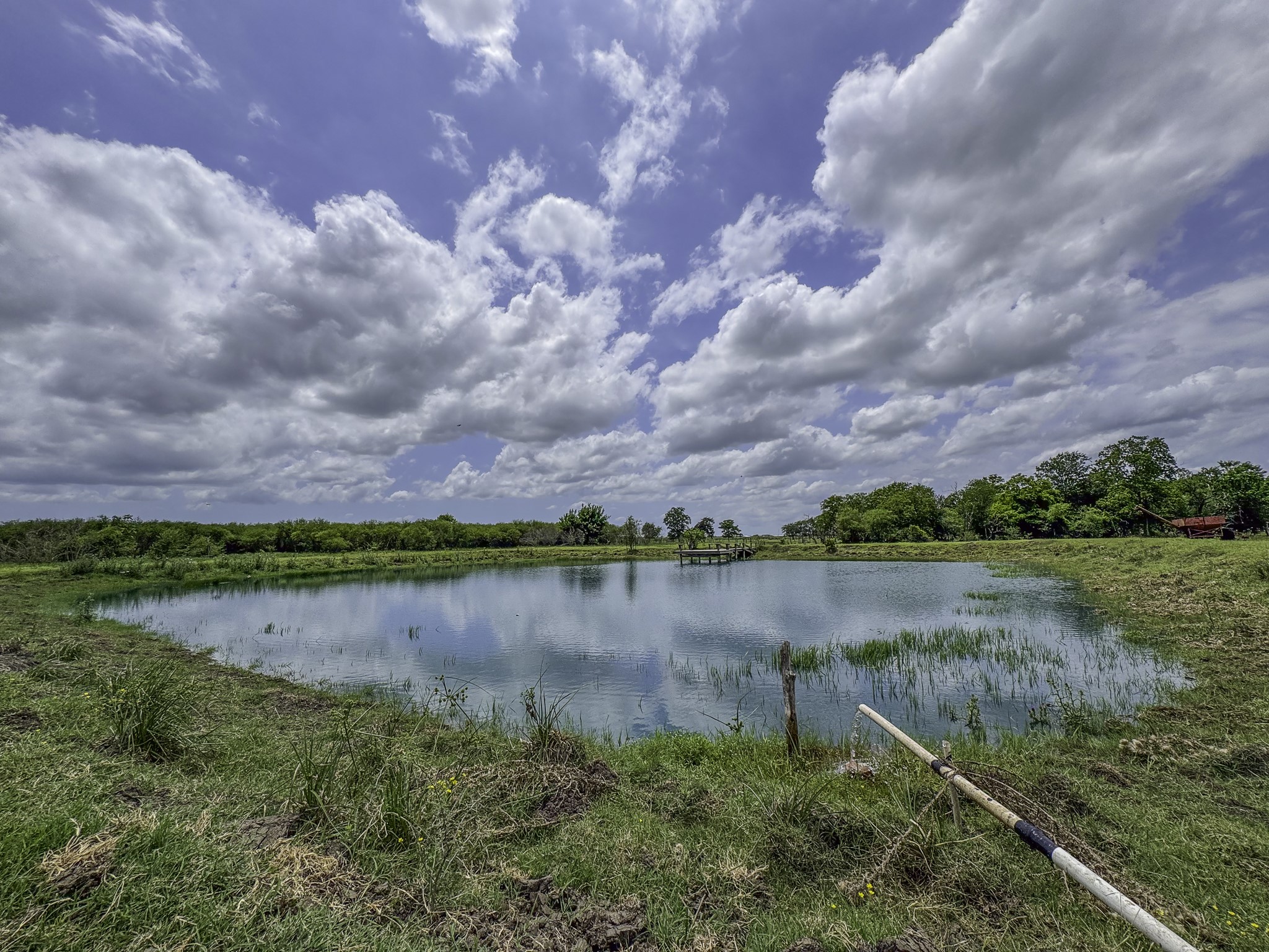 11810 Zamanek Road Needville, TX 77461 - Photo 27 of 30 a view of a lake with houses in the back