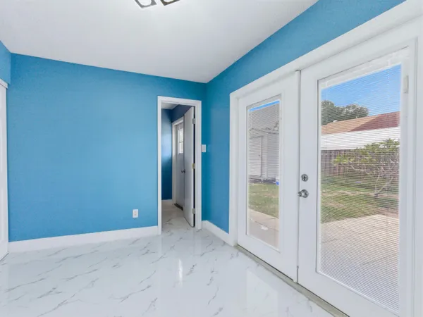 a view of an empty room with a window