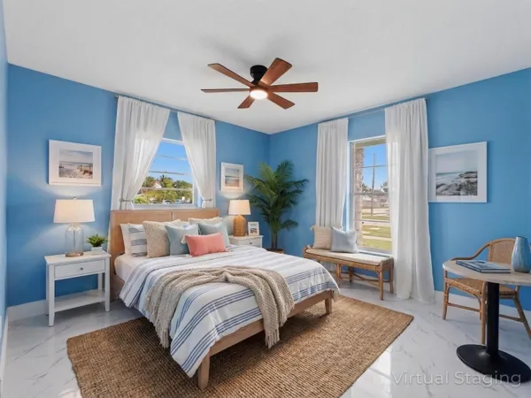 an empty room with closet and fan