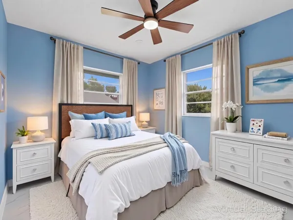 an empty room with chandelier fan