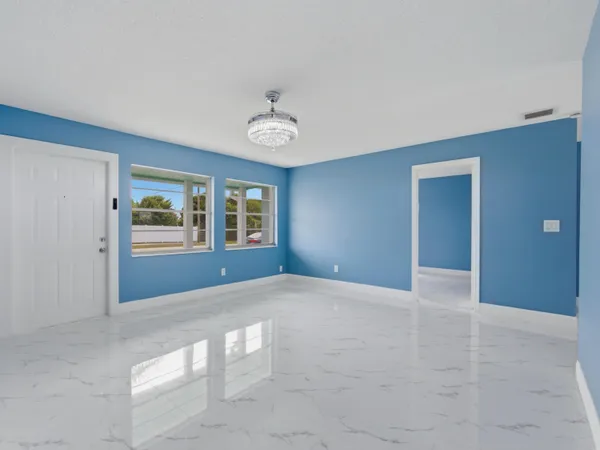 a view of an empty room with a window