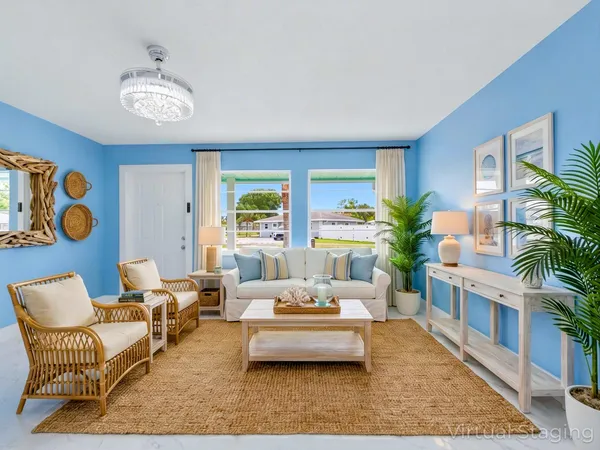 a view of a kitchen with refrigerator and front door