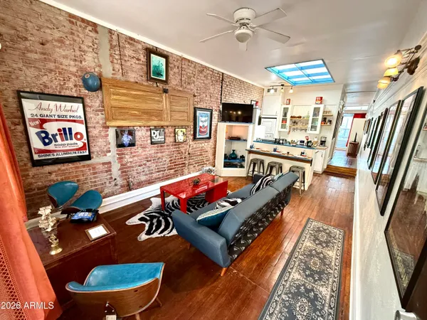 a living room with furniture pool table and rug