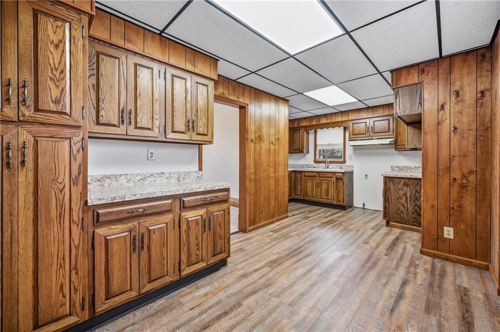 564 Spruce Avenue Sharon, PA 16146 - Photo 13 of 37 a kitchen with granite countertop wooden cabinets and refrigerator