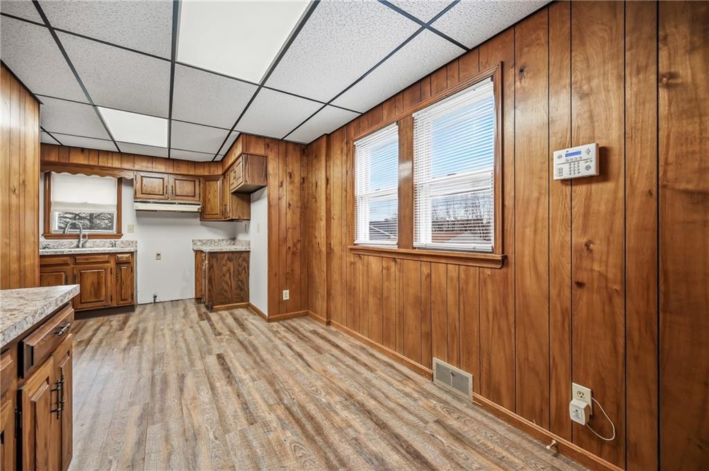564 Spruce Avenue Sharon, PA 16146 - Photo 14 of 37 a view of a refrigerator in kitchen and wooden floor