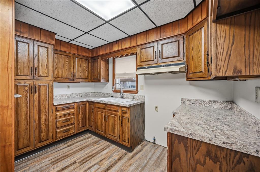 564 Spruce Avenue Sharon, PA 16146 - Photo 15 of 37 a kitchen with stainless steel appliances granite countertop wood cabinets a sink and dishwasher
