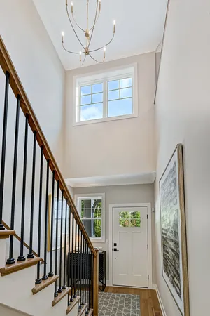 a view of an entryway with wooden floor