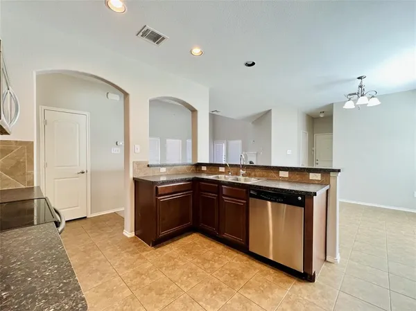 a large bathroom with a sink and a large mirror
