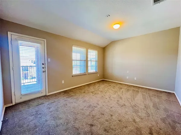 an empty room with a empty space and windows