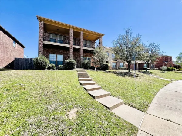 a view of a house with a yard porch and sitting area