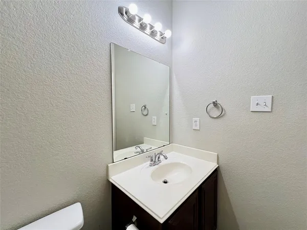 a bathroom with a sink and a toilet