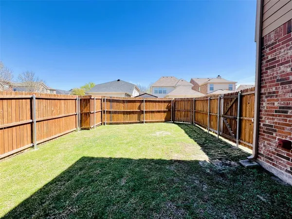 a view of a backyard with a garden and stairs