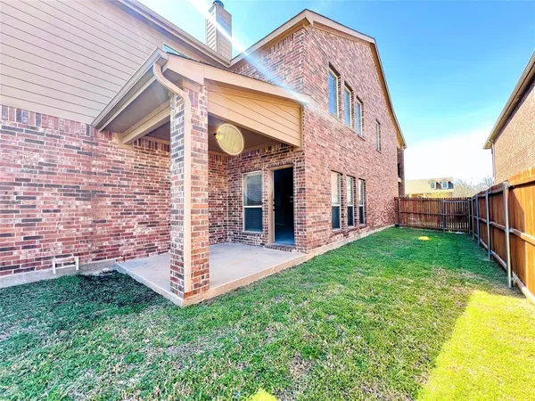 a view of a street with brick building
