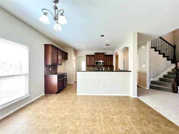 a view of kitchen with furniture and window