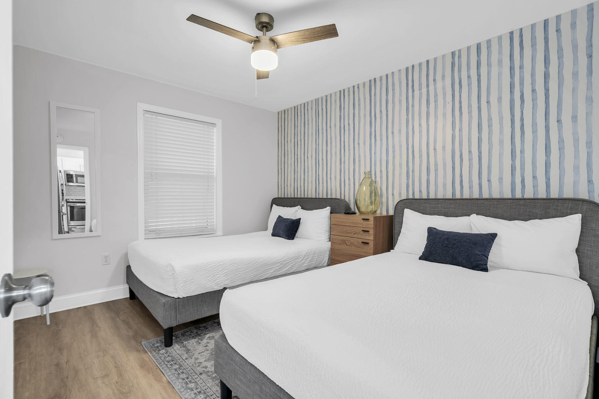 11 Beachside Drive, Unit 131 Santa Rosa Beach, FL 32459 - Photo 10 of 25 a bedroom with two beds and painting on the wall