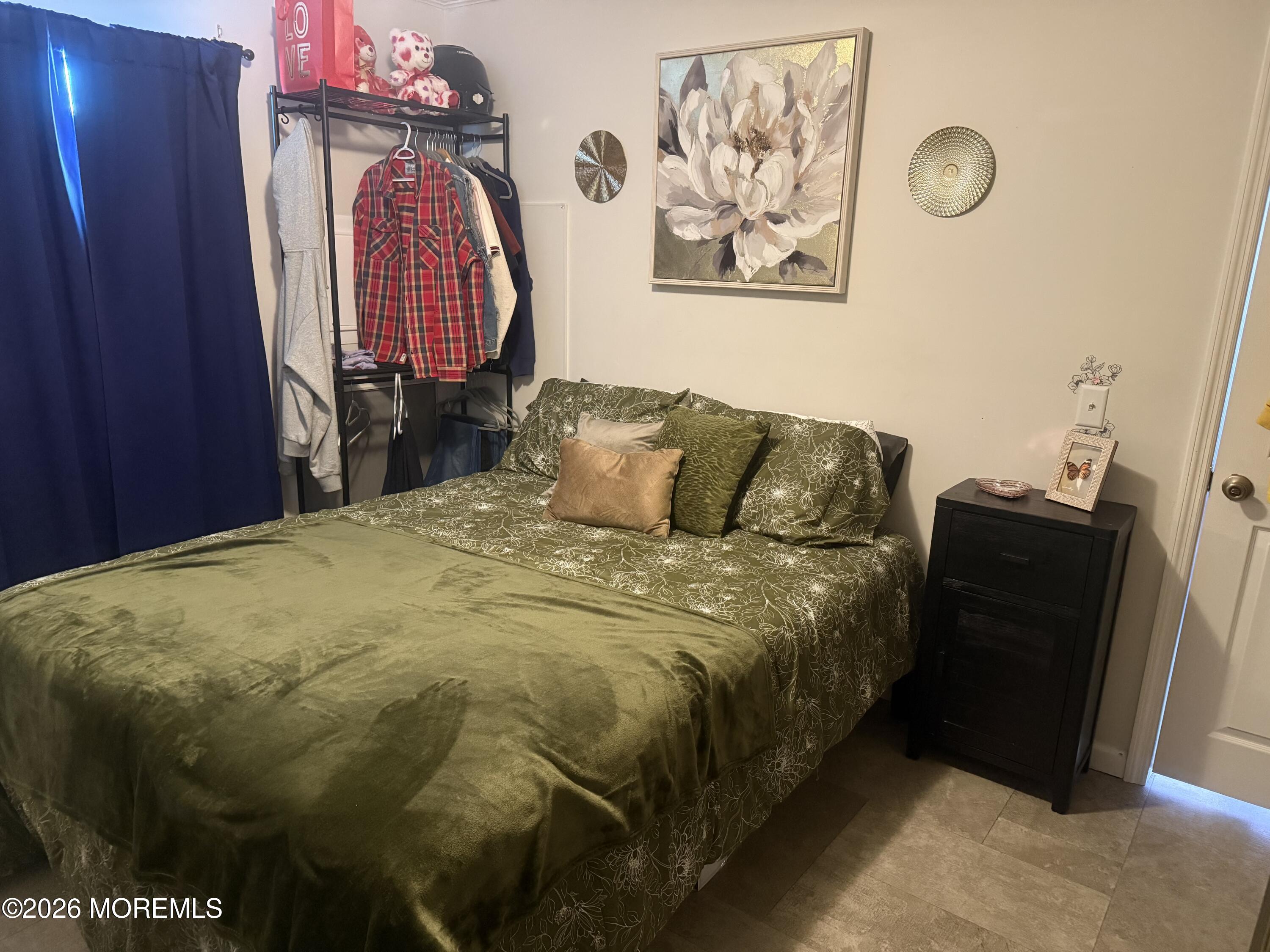 52 Monique Circle Hazlet, NJ 07730 - Photo 11 of 12 a bedroom with a bed and a painting on the wall