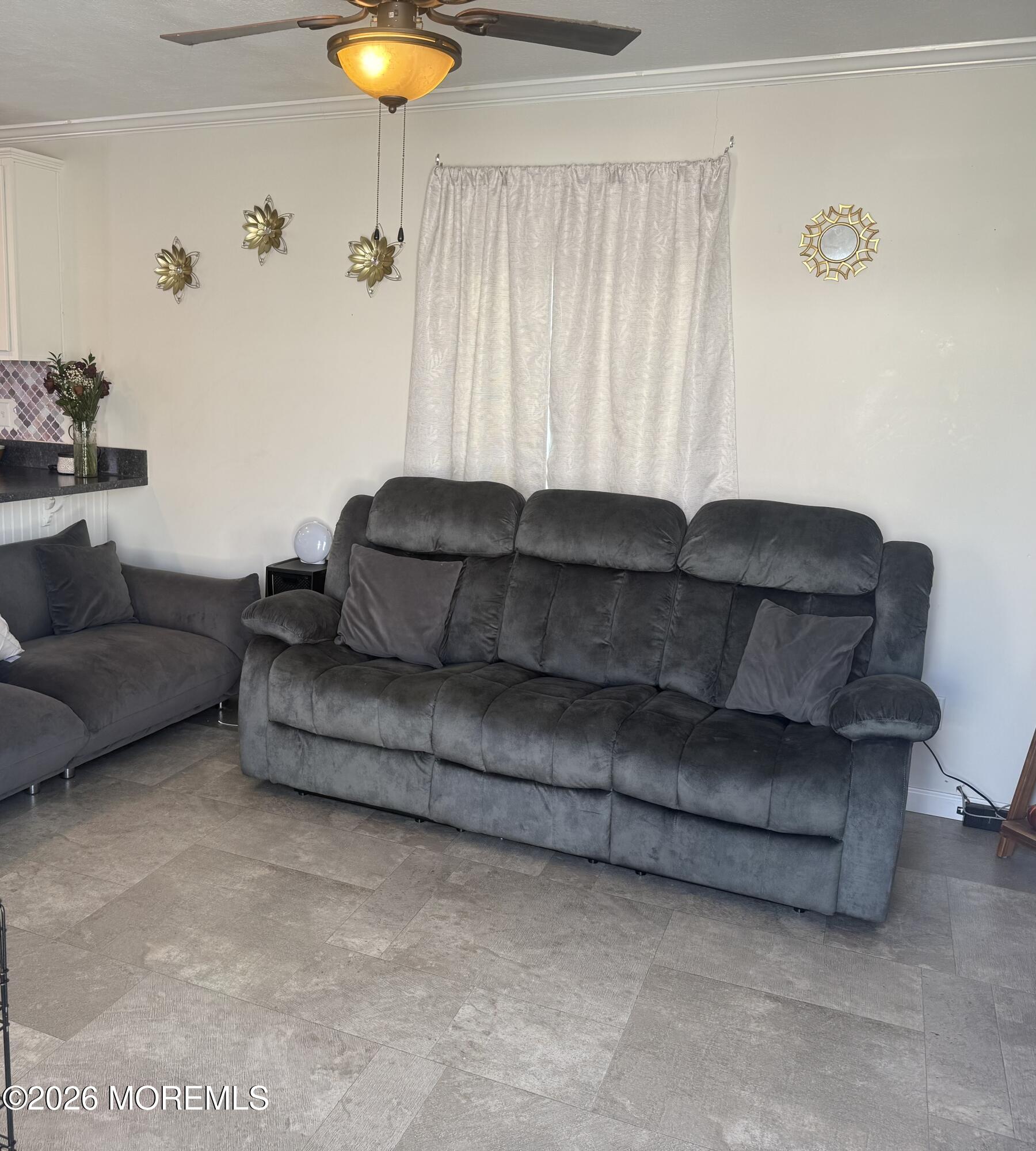52 Monique Circle Hazlet, NJ 07730 - Photo 12 of 12 a living room with furniture and a chandelier