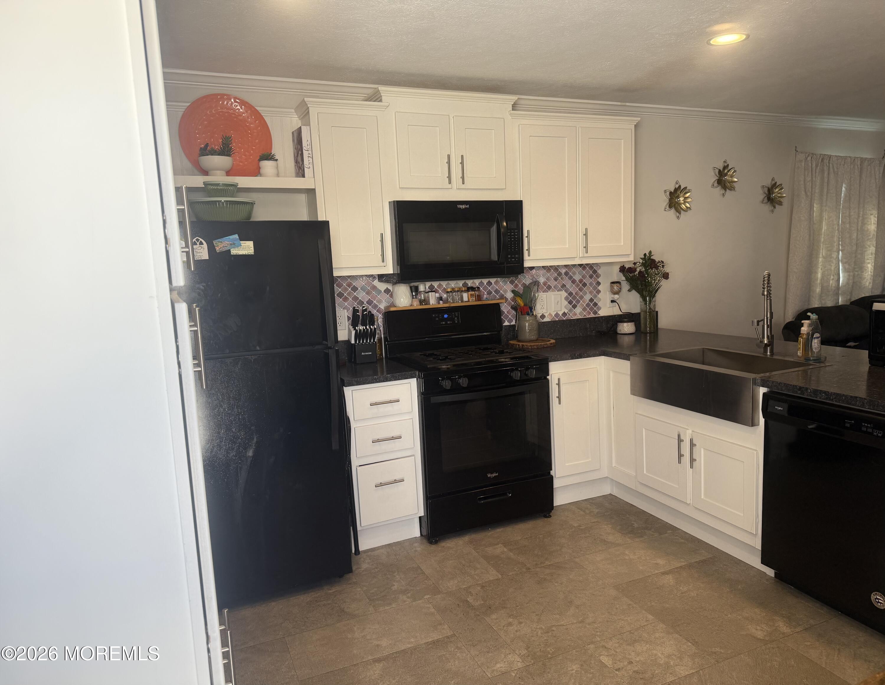 52 Monique Circle Hazlet, NJ 07730 - Photo 4 of 12 a kitchen with stainless steel appliances a refrigerator stove and sink