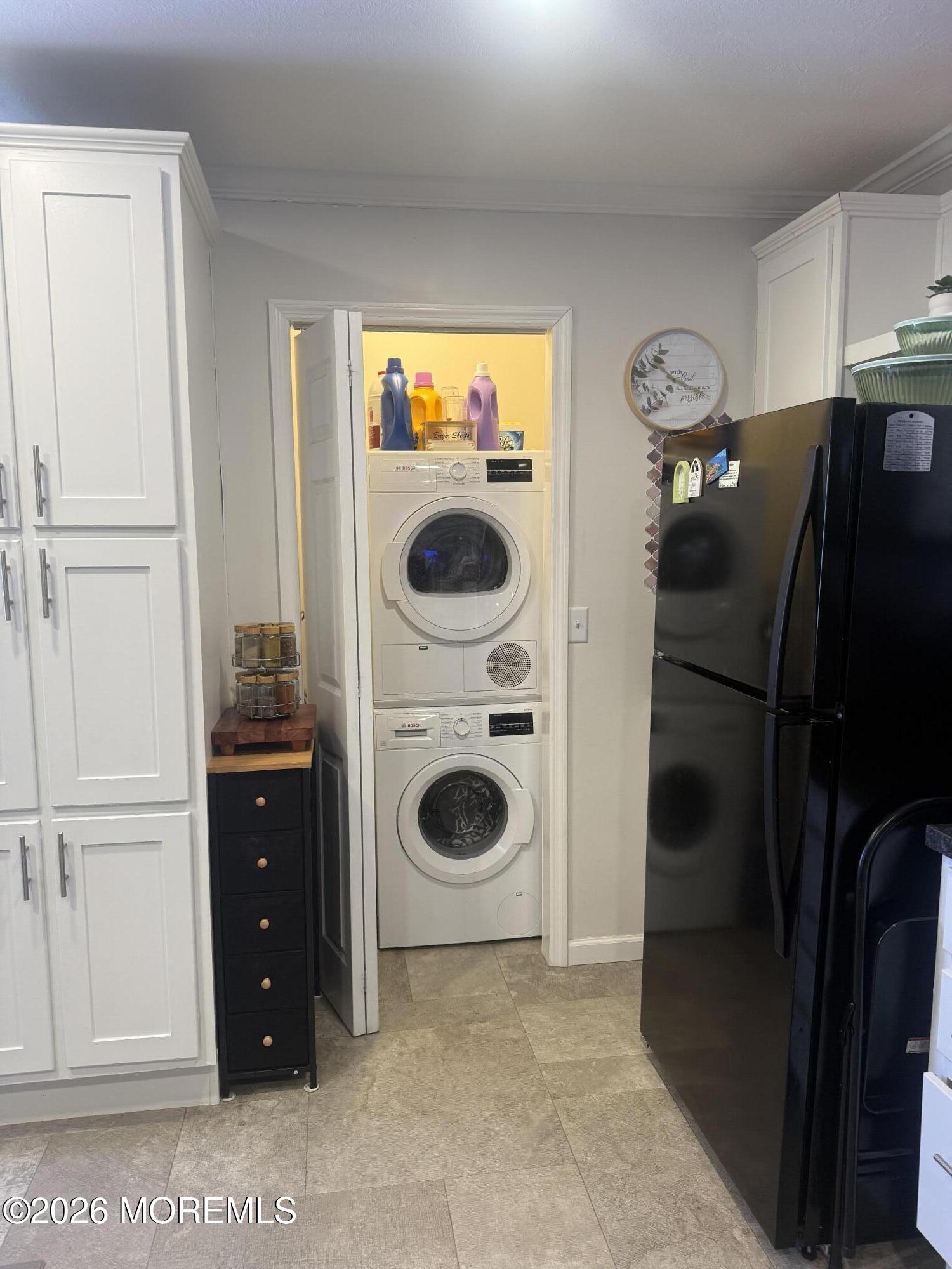 52 Monique Circle Hazlet, NJ 07730 - Photo 5 of 12 a view of a kitchen with a refrigerator and cabinets