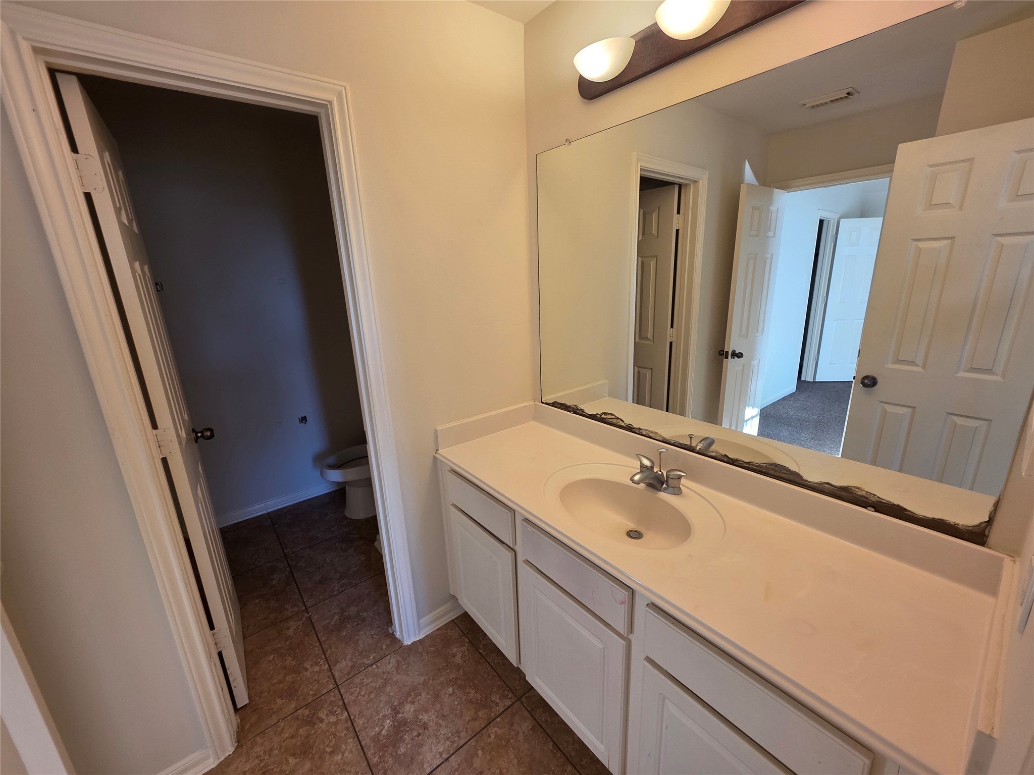 22231 Bridgestone Oak Drive Spring, TX 77388 - Photo 17 of 25 a bathroom with a sink a mirror and a shower