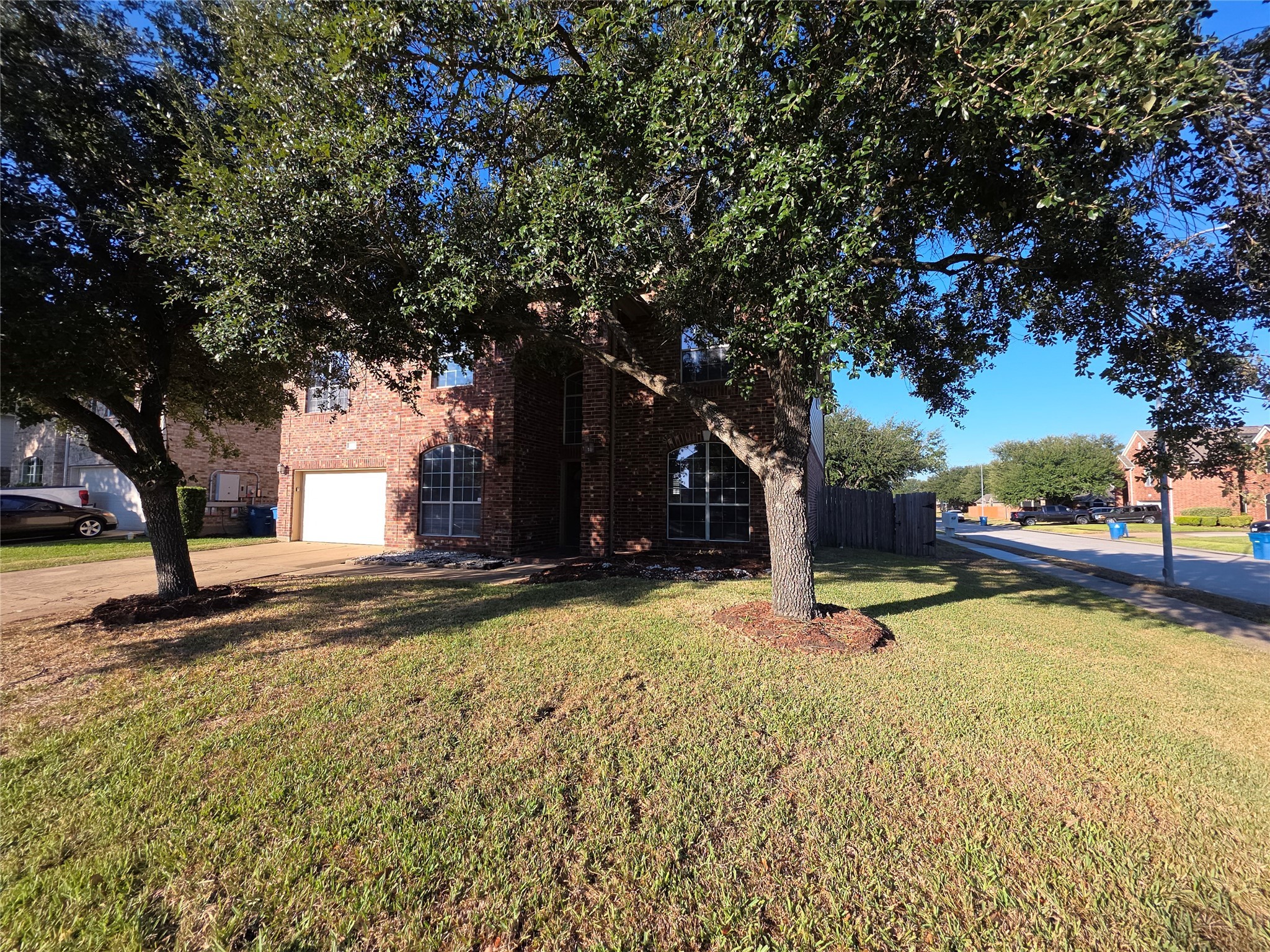 22231 Bridgestone Oak Drive Spring, TX 77388 - Photo 2 of 25 a view of a swimming pool with an outdoor space and seating area