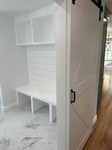 a bathroom with a sink toilet and mirror