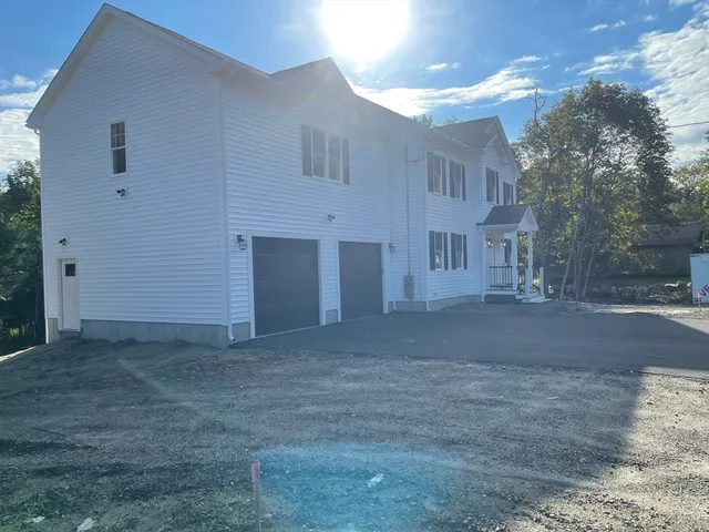 a view of a house with a street