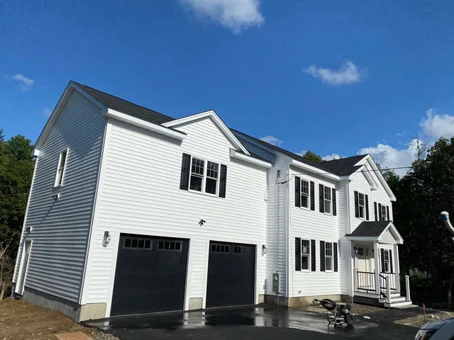 a view of a house with a street