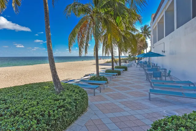 a view of a backyard with chairs