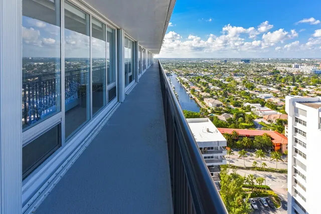 a view of swimming pool from a balcony