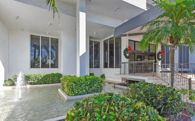 front view of a house with a garden