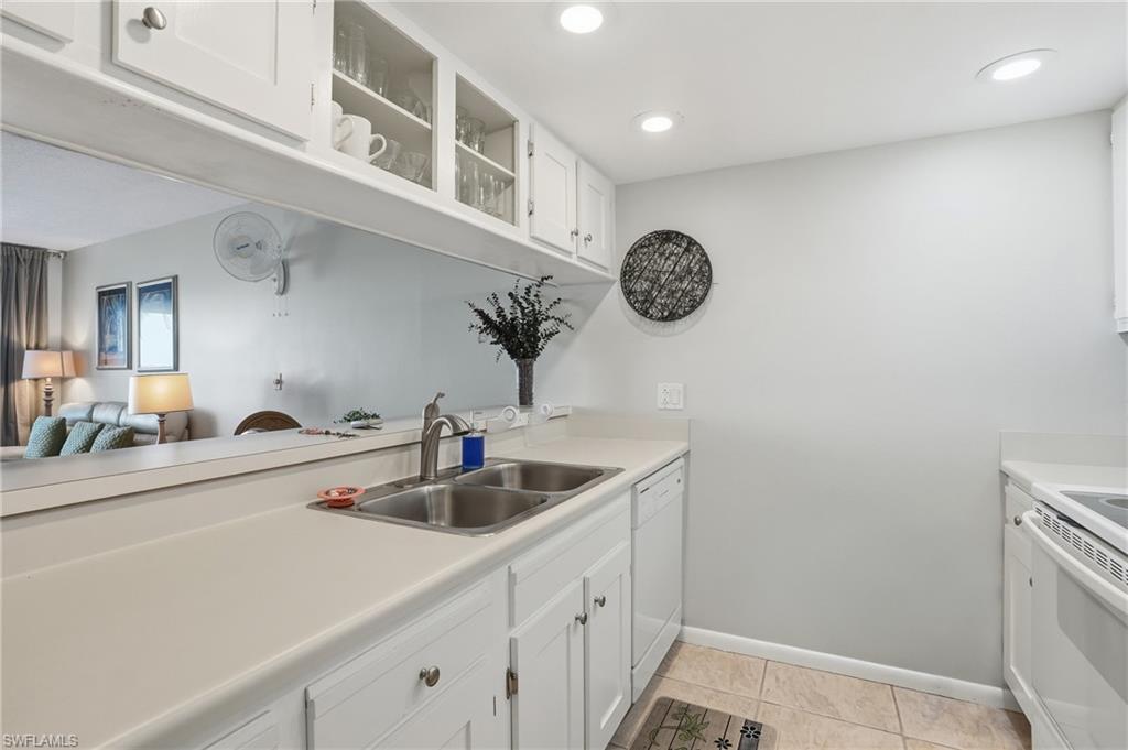 2875 Palm Beach Boulevard, Unit 202 Fort Myers, FL 33916 - Photo 16 of 38 a kitchen with a sink and cabinets